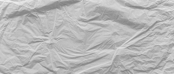 Old white crumpled paper texture background. Vintage wallpaper banner.