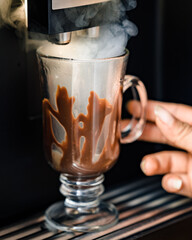 Making espresso coffee with cappuccino glass