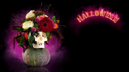 Skull decorated with flowers and a burning Halloween inscription on black background