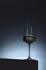 White wine in a transparent glass in low key