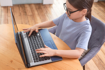 student doing online lessons, online education concept, online learning with kids at home