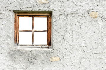 Hauswand mit einem durchsichtigen Fenster mit Holzrahmen und Fenstergitter als Hintergrund