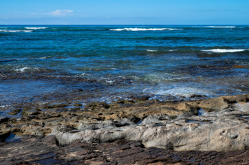 Rock Beach and Blue Ocean and Sky.