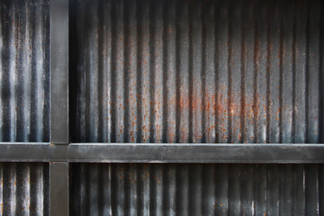 Obraz premium black rusty galvanized iron background with iron rack
