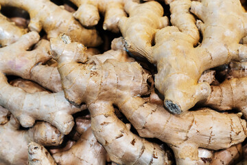 Ginger roots. Trade in vegetables and spices in a store or market. Close-up