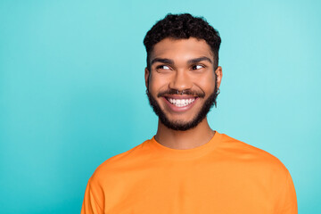 Close up photo of postive cheerful man interested look empty space shopping low price black friday isolated on cyan color background