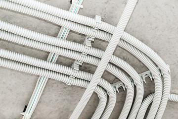 Electrical wiring in a protective corrugation. Installation and wiring of electrical networks in an...
