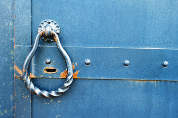 Fragment of a metal door in retro style. Close-up