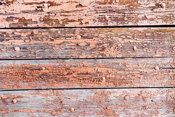Wooden boards with peeling paint. Cracked surface of an old wall. Close-up. flat lay frame