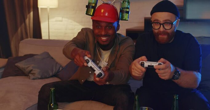 Happy friends playing video games using playstation