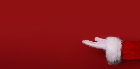 Santa Claus hand presenting your text, product, advertisement on a red background.Mockup. Copy space. Banner