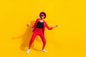 Photo of cool attractive short hair human wear formal outfit cap dark spectacles dancing isolated yellow color background