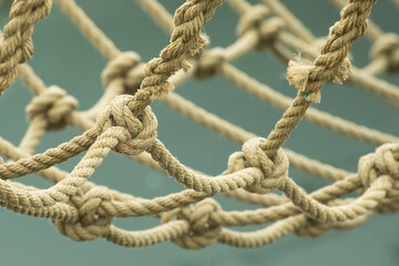 Closeup of a net made of thick brown ropes