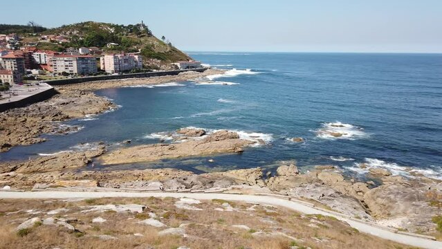 PAN SHOT - Cuncheira Beach and the Cies Islands viewed from the Monterreal Fortress on the Monte Boi peninsula in the Galician village of Baiona, Galicia, Spain.