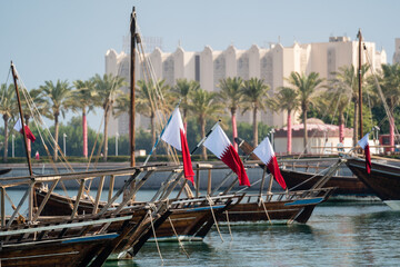 Traditional arabian dhows with Qatar flags in Doha , Qatar.