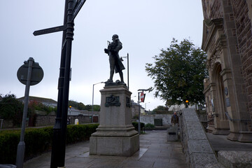 Camborne Cornwall UK 10 18 2022 Passmore Edwards library of 1895 with statue of Trevithick. Edwards was a Cornish born philanthropist who funded several public buildings accross Cornwall. 