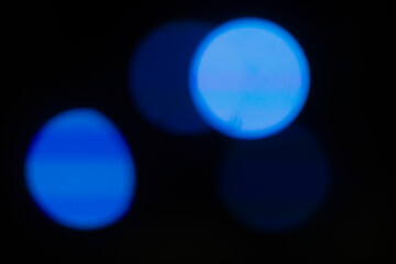 Stage lighting. Spotlights with colored lights on a stage. Artificial lighting. Black background and blur.