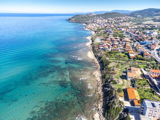 Aerial view of Lu Bagnu turquoise sea on a sunny day