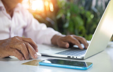 Business man studying trading and investing information for future online sales.