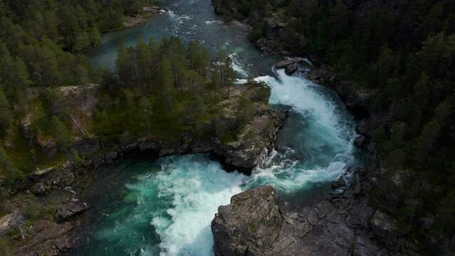 Aerial topdown view of powerful ocean current forming whirlpools and eddies,