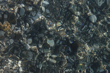 Stones in clear sea water as a texture background image