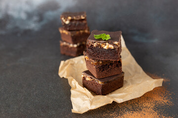 Chocolate nut brownie cake decorated with mint.