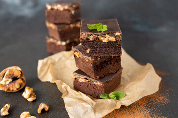 Chocolate nut brownie cake decorated with mint.