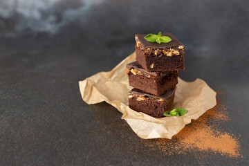 Chocolate nut brownie cake decorated with mint.