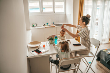 Family of three sitting at the breakfast table