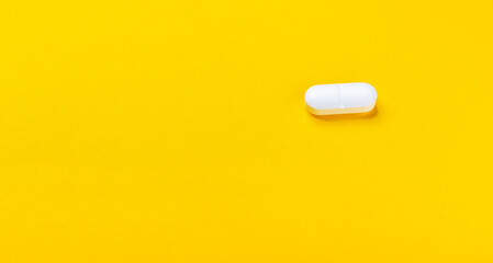 medical pills close-up on a yellow background