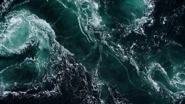 Footage of abstract water currents, rapids and whirlpools in fjord. Saltstraumen Norway