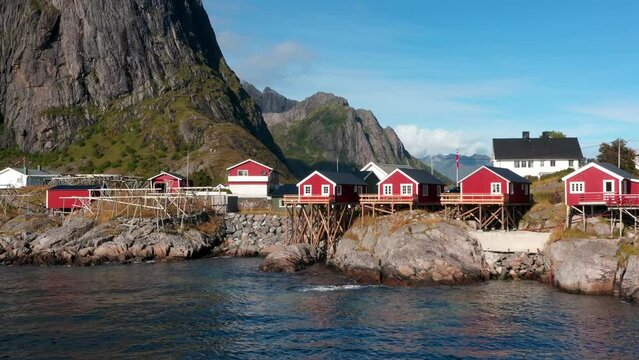 Aerial drone view of Hamnoy in Lofoten islands in Norway on a sunny day. Fjords and mountains at sunset 