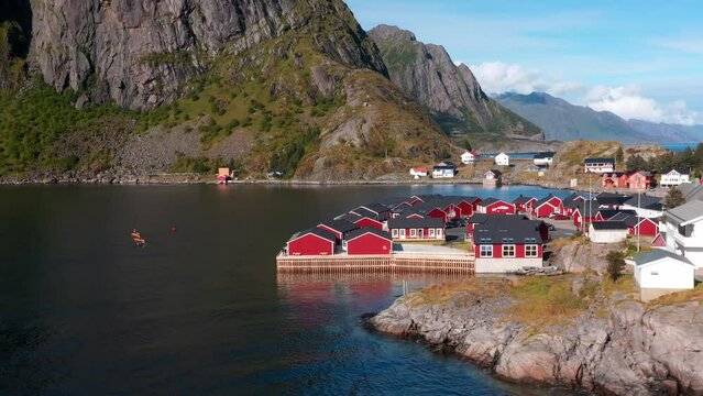 Aerial drone view of Hamnoy in Lofoten islands in Norway on a sunny day. Fjords and mountains at sunset 