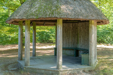 An old pavilion, gazebo, arbor in the forest