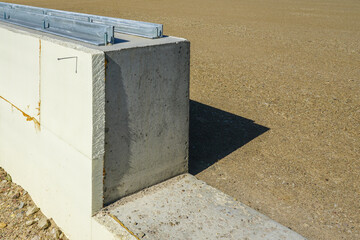 prepared base and concrete border for installation of inflatable playing arena, football hall