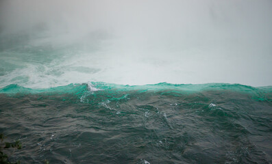Fototapeta na wymiar Water background - the edge of the water of Niagara Falls 