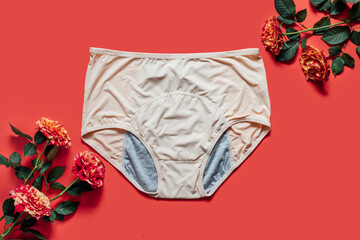 Reusable Period Underwear with rose flower on red background. Absorbent and Affordable Period panties to absorb menstrual fluid