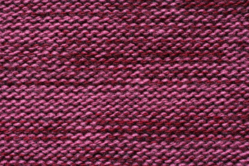 Purple melange woolen knitted fabric texture. Macro.