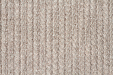 Light beige woolen knitted fabric texture. Macro. - obrazy, fototapety, plakaty