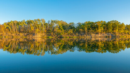 reflection of autumn trees in the water