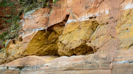 Sandy rock wall on the banks of the River Gauja. Gauja national park, Latvia