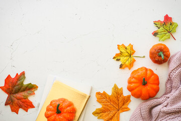 Fall background. Autumn flat lay background. Autumn cloth and fall decorations - pumpkin, leaves and other.