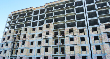 A tall, unfinished brick building