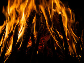 Bonfire flames. Bonfire at night, bright, orange flames.