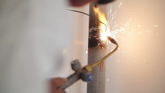 soldering a pipe with gas welding
