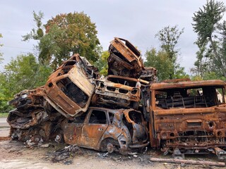 Fototapeta premium A bunch of burned and shelled cars in Hostomel in the Kyiv region