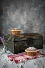 Homemade cupcakes and vintage jewelry box on wooden table