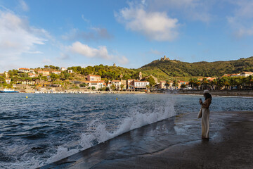 The girl and the crashing waves