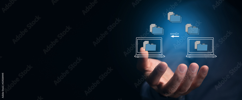 Poster transferring files between laptops on a virtual screen.