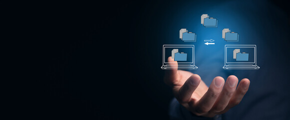 transferring files between laptops on a virtual screen.